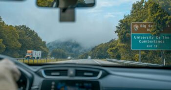 Driving through misty mountains on a highway near university of the cumberlands.