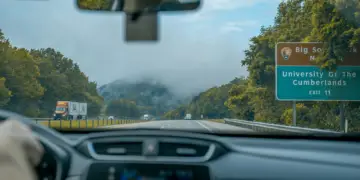 Driving through misty mountains on a highway near university of the cumberlands.
